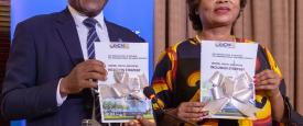 Executive Director of EACREEE, Canon Goddy Muhanguzi and UN Women Country Rep, Dr. Paulina Chiwangu officially launch the Strategy. (Photo ©️ Alan Sherrard)